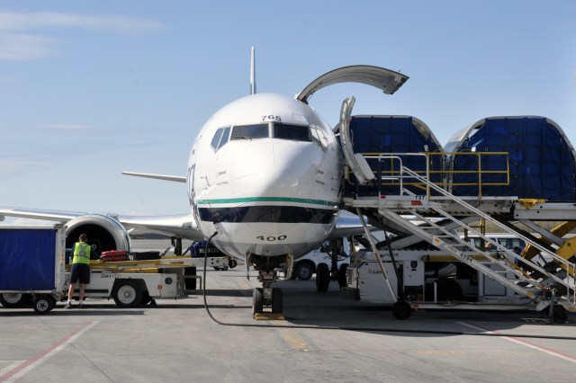 An Alaska Airlines 737-400 Combi – half cargo, half seats for passengers – is loaded in Anchorage, Alaska. 