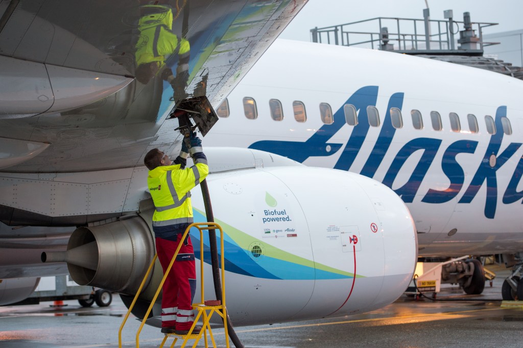 Swissport fuel manager Jarid Svraka fuels an Alaska Airlines flight powered with a 20 percent blend of biofuel made from forest residuals in Sea-Tac Washington on Nov. 14, 2016.