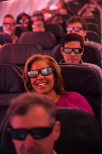 Danielle Nottingham, with CBS news out of Los Angeles, sports some eclipse viewing shades on Alaska Airlines Great American Eclipse Flight.