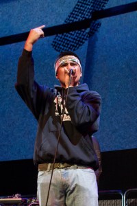 This is a photo of a student rapping on stage as part of the Residency Program's showcase concert.