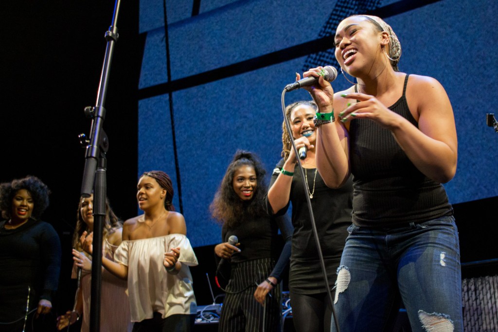 This is a photo of a group of students performing live on stage in the Residency's professional performance.