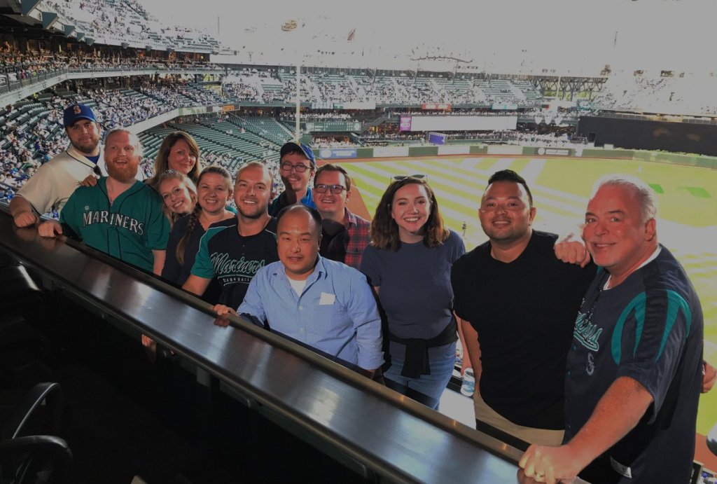 This is a photo of the Alaska Airlines social care team wearing Mariners gear. The team is based in Seattle.