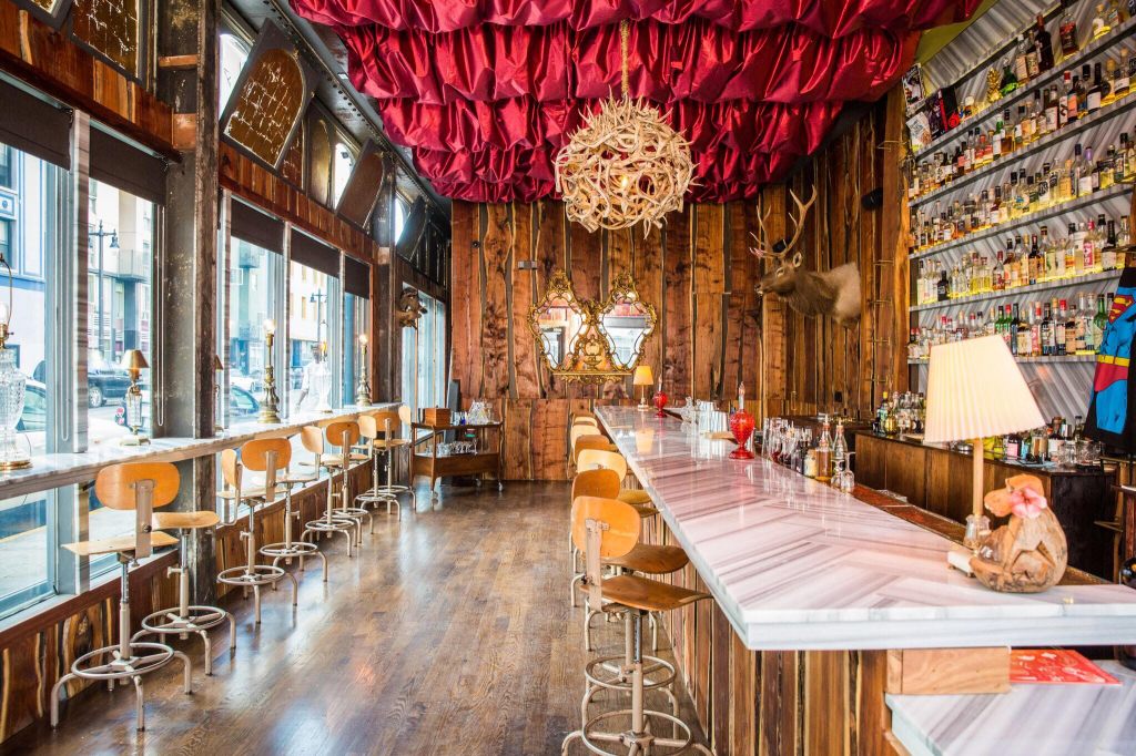 This is a photo of the Bar Biig. It was wooden floors and walls with bright lights and a rustic design.