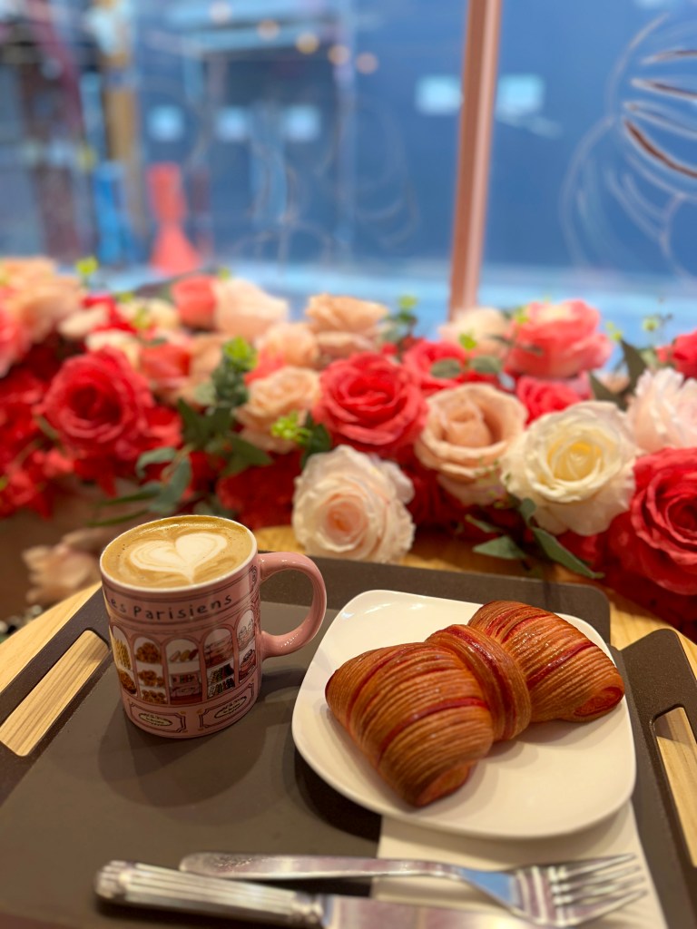 Cafe Author's image of her coffee and croissant.
