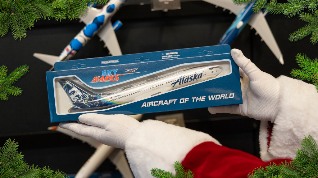 Alaska model aircraft being held by Santa
