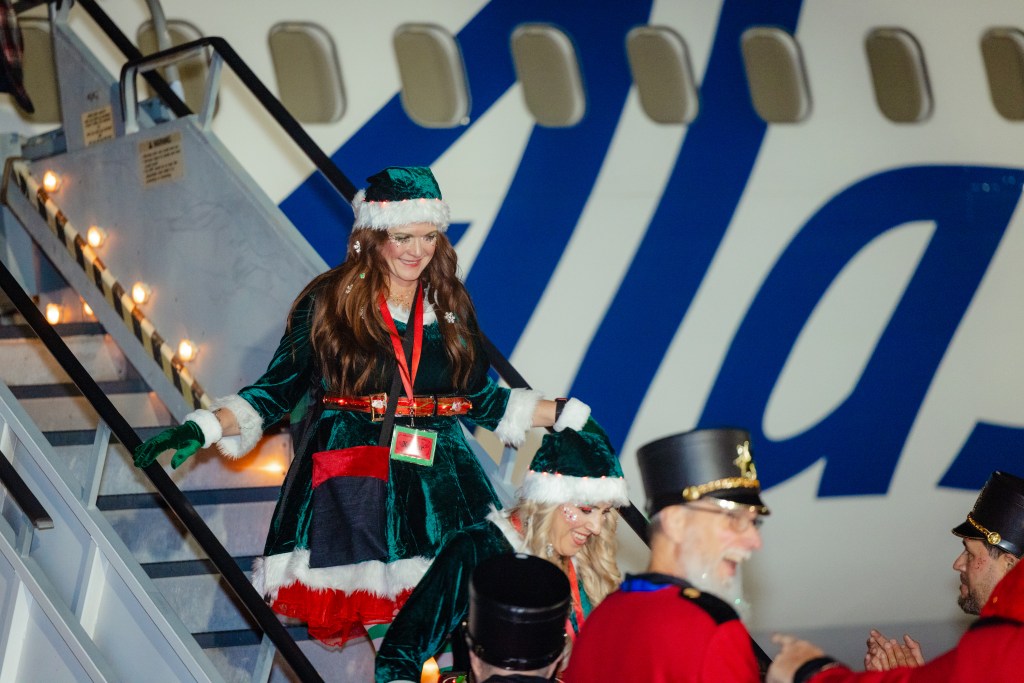 Elf coming out of an Alaska Airlines aircraft
