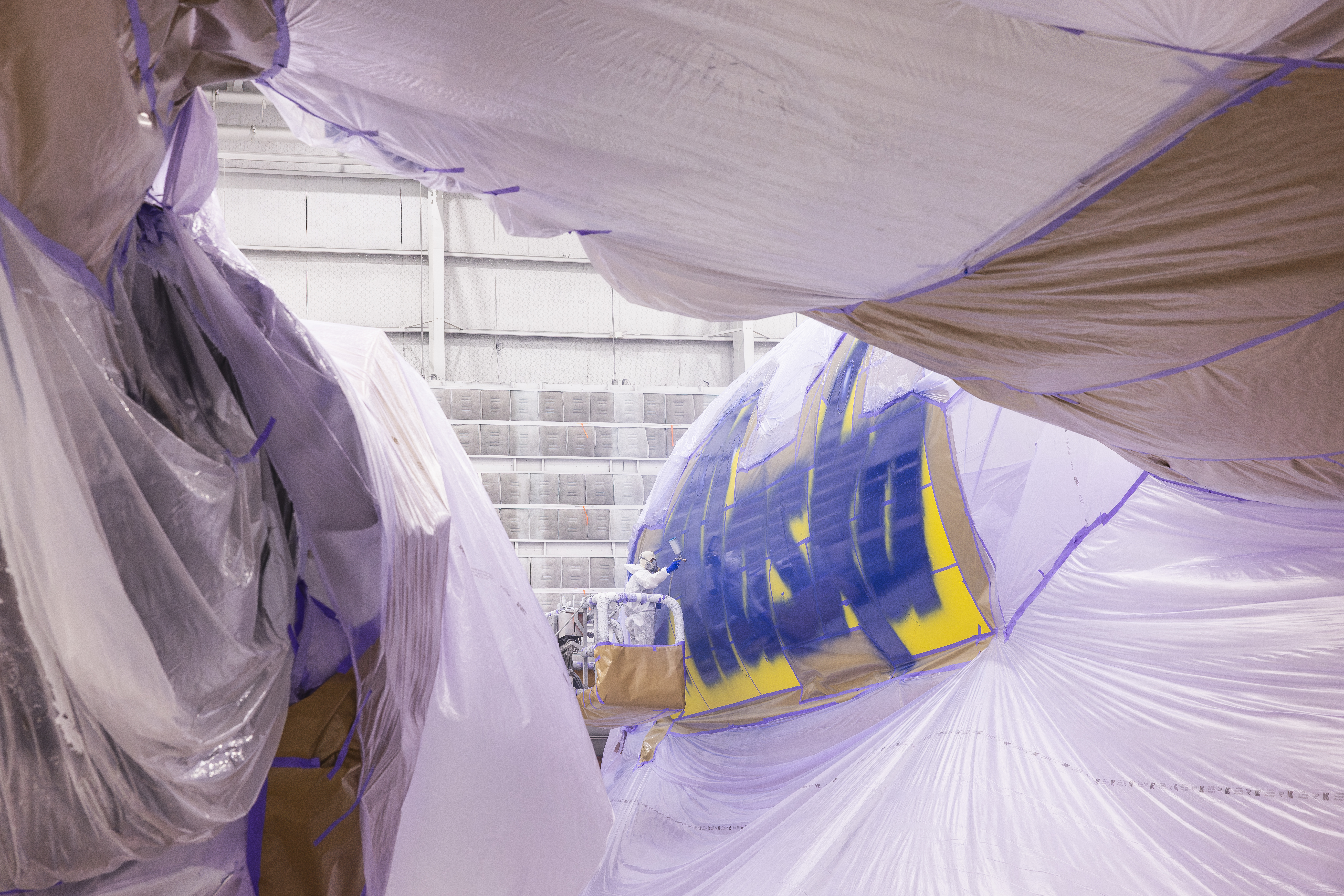 Alaska Airlines logo being painted on aircraft