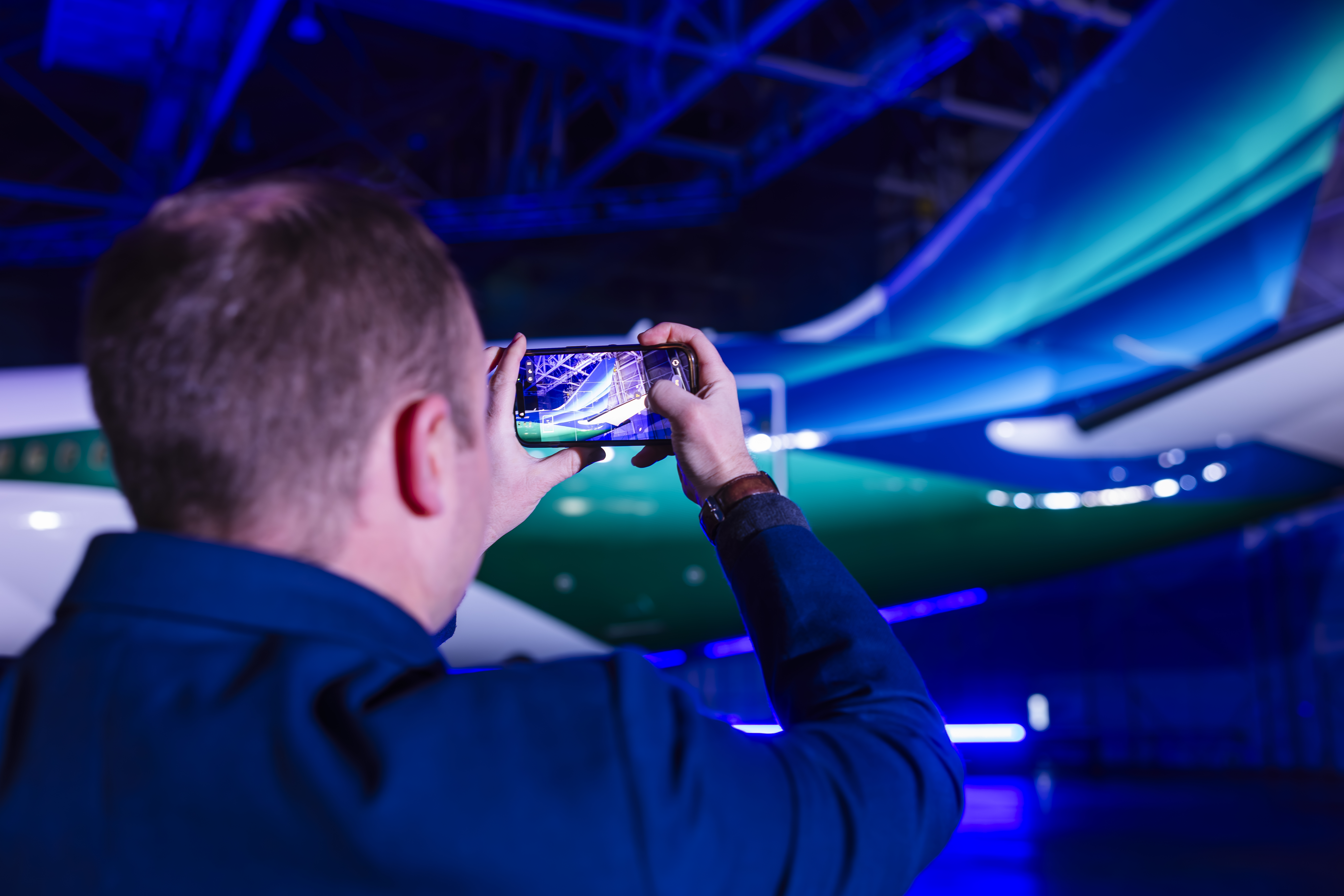 Employee photographing the Boeing 787