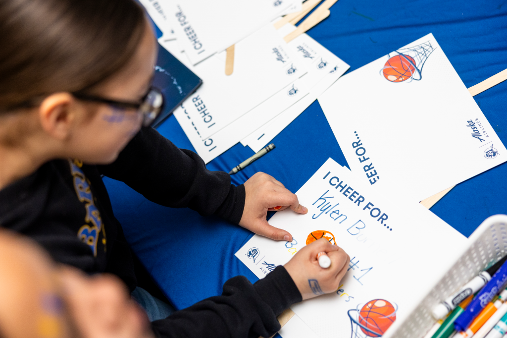 Sign making at March Madness Alaska