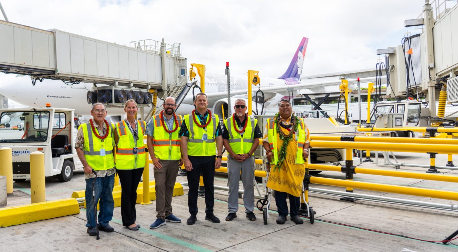 Hawaiian Airlines and Hawaii Department of Transportation officials at the press conference unveiling the new electric ground support fleet at HNL
