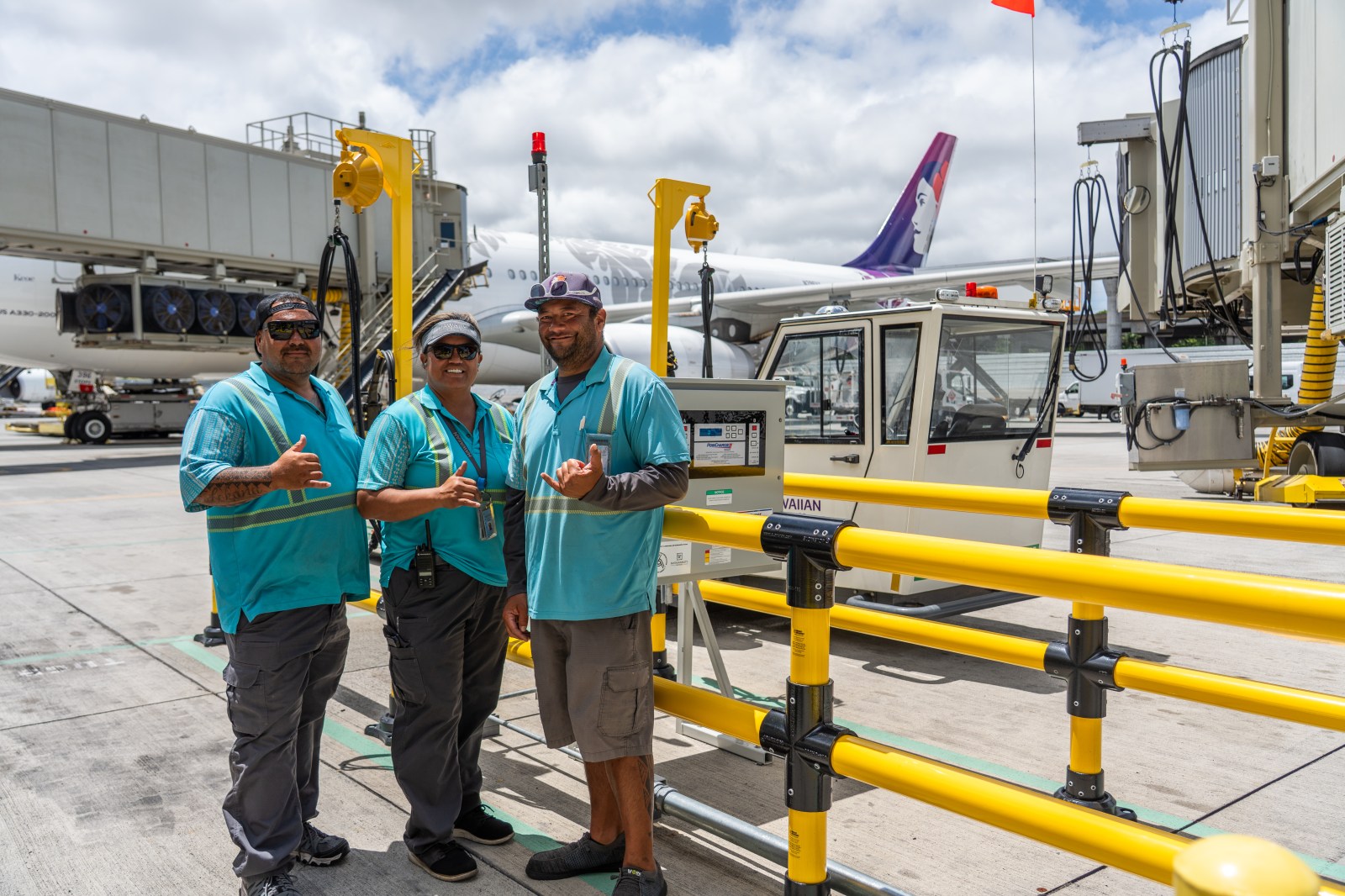 Hawaiian Airlines ramp crew working with the new electric ground support equipment at HNL