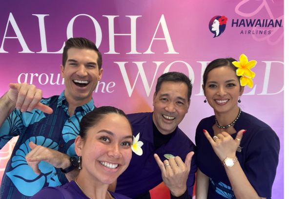 Image of intern taking a selfie with Hawaiian flight attendants