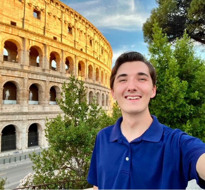 Image of intern taking a selfie outside the Colosseum in Rome