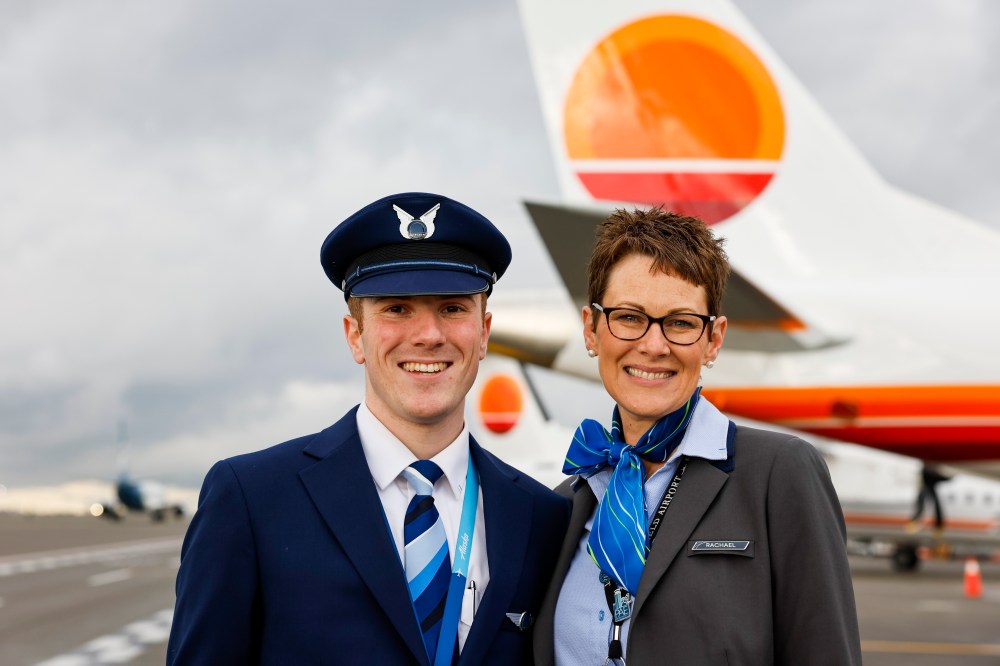 Austen and his mom in front of a Horizon tail