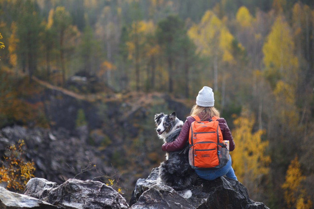 Girl with her dog hiking