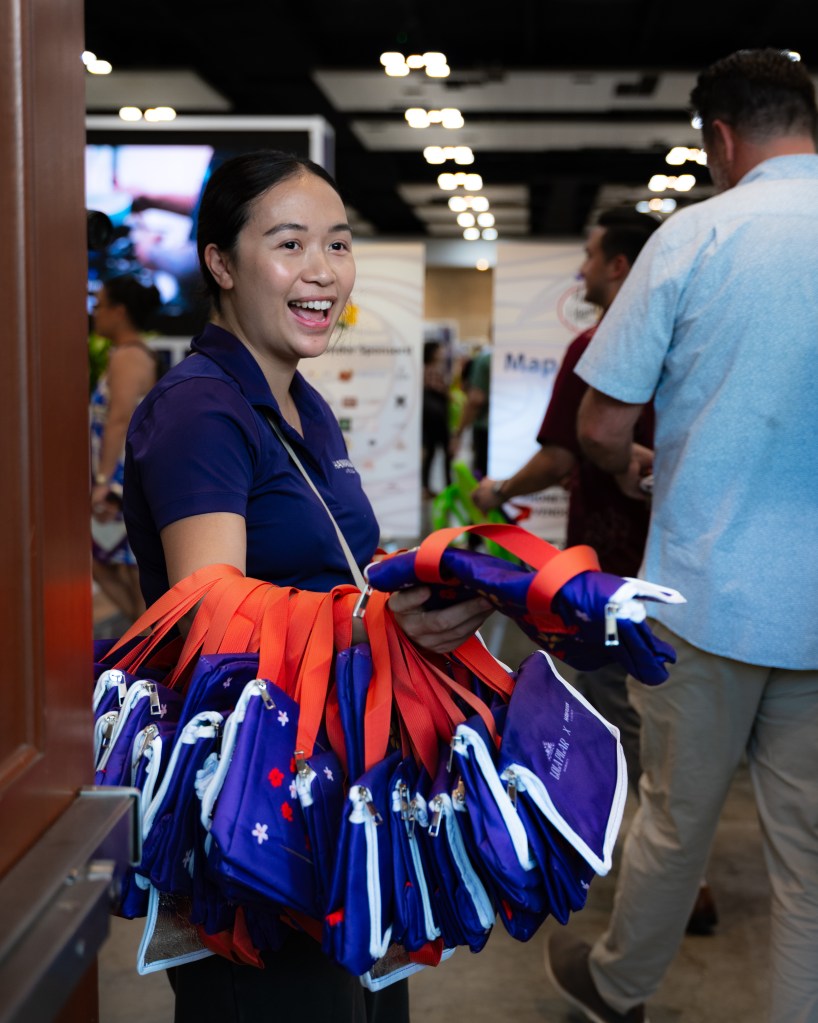 Woman handing out free bags