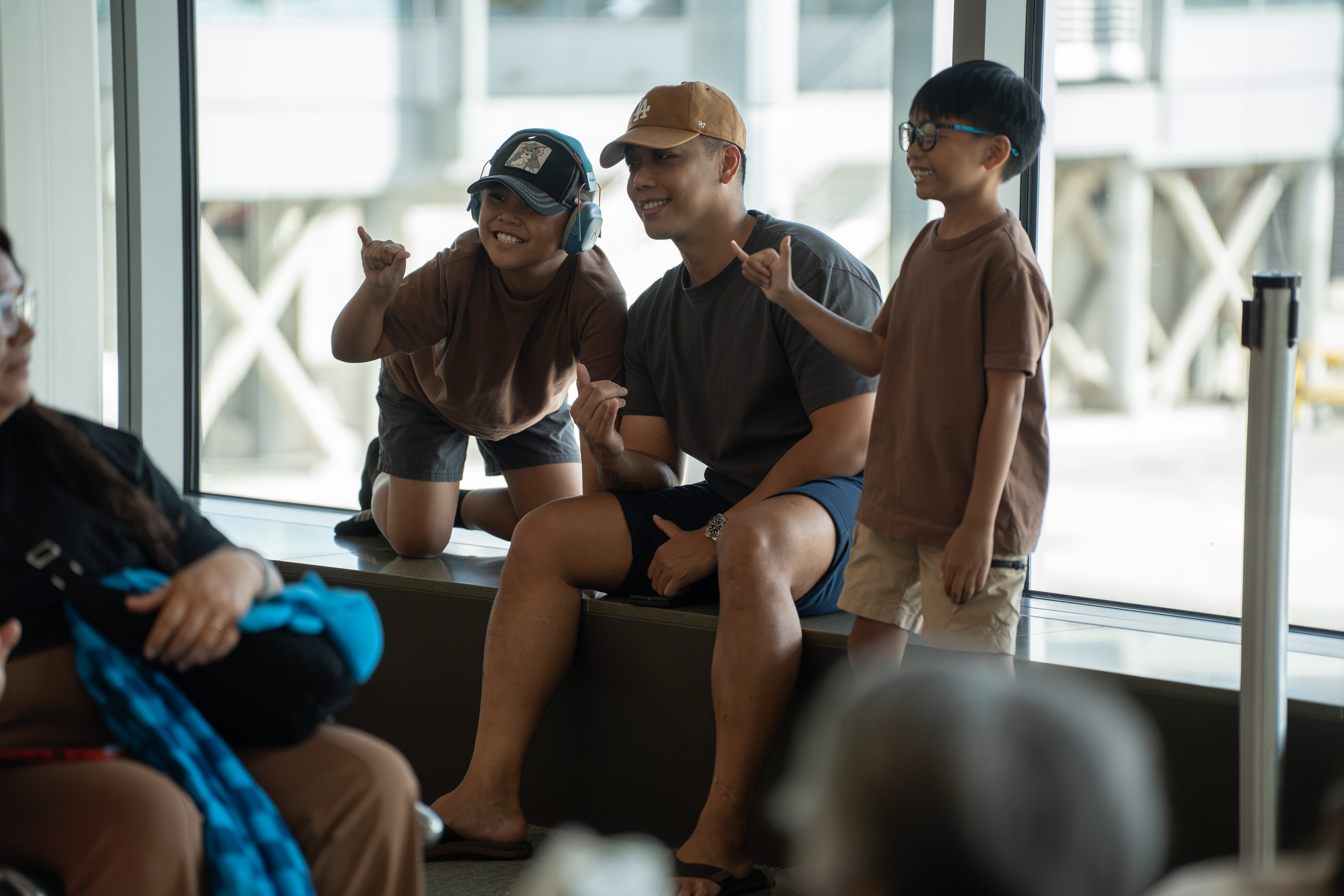 Father with two sons at gate