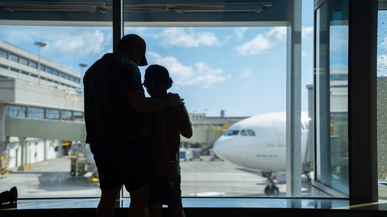 Father and son at gate